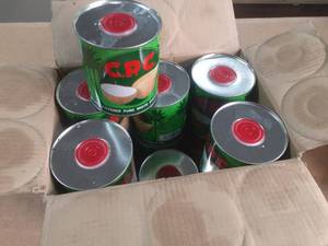lot 129 image: Case of CPC Coconut oil cans, past date