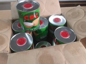 lot 130 image: Case of CPC Coconut oil cans, past date