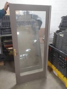 lot 77 image: Very Nice Set Sliding Glass Doors. Perfect for use to the patiodeck or for a lower level walk out.