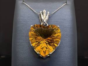 lot 72 image: Large Brilliant Heart Cut Golden Pendant VIDEO