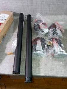 lot 69 image: 28 in. (711 mm) Matte Black Adjustable Folding Table Leg & 5 in. Black PP Caster Kit for Ready-to-Assemble Steel Garage Base Cabinets- open box not used