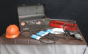 lot 59 image: METAL TOOL BOX PLUG IN DRILL  HARD HAT
