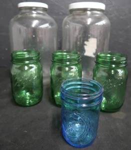 lot 107 image: COLORED JELLY JARS