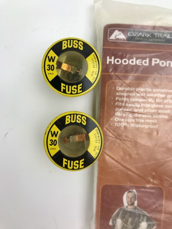 lot 71 image: Vintage - Buss Fuses  Poncho  Flashlight  Watch Part Cases