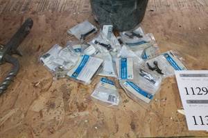 lot 1131 image: Lot of Door Stops (in packages, in bucket)