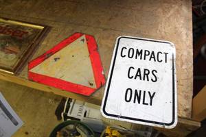 lot 1176 image: Lot of (2) Metal Signs - Caution Triangle, Compact Cars Only