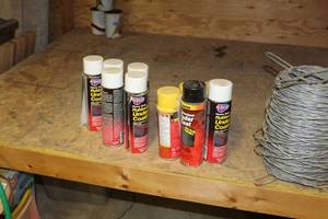 lot 1626 image: Lot of (10) Shop Chemicals (in bucket)  with Rubberized Undercoating (x7), Stop Gap (x3)