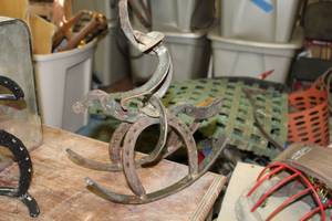 lot 1669 image: Handmade Metal Cowboy Riding Bronco Horseshoe Figurine  12-12H