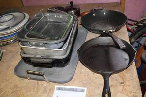 lot 1659 image: Lot of (Approximately 12) Kitchen Cookware  with Cast Iron Pan, Wok, Baking Pans, Glass Baking Dishes, Cooking Pans with Lids