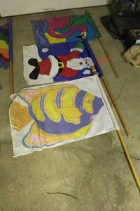 lot 1681 image: Lot of (3) Decorative Flags  with Flamingo, Fish, Santa