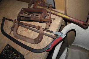 lot 1719 image: Lot of (Approximately 6) Hand Tools  with C-Clamps, Pipe Wrench, Bow Saw, Pry Bar, Hammer
