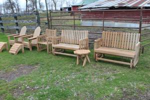 lot 1025 image: Wood Patio Set  with Swinging Bench (x2), Adirondack Chair with Ottoman (x2), Chair (x1), Side Table (x1)