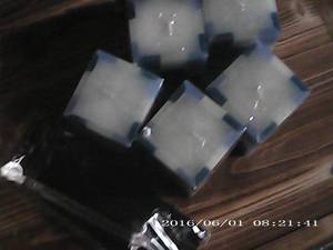 5 square candles and a wick trimmer...