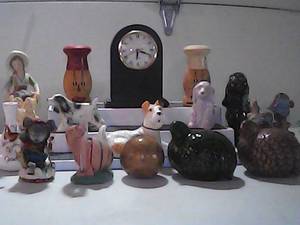 Variety of collectibles Ceramic dogs, fish, mice, quails, a clock, rain gauge, wooden salt and pepper, stair display not included.