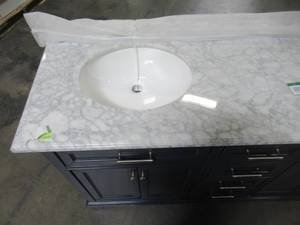 lot 205 image: Home Decorators Collection Windlowe 61 in. W x 22 in. D x 35 in. H Bath Vanity in Navy Blue with Carrara Marble Vanity Top in White with White Sink 15101-VS61C-NB