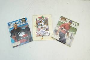 lot 158 image: World series program, Tiger Woods magazines