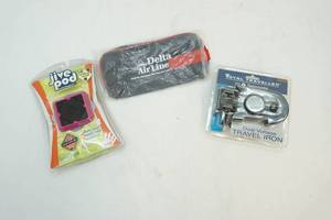 lot 243 image: Pouch, Music player, travel iron