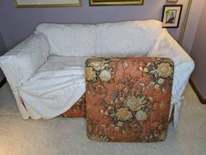 lot 13 image: Orange Floral Loveseat with Slipcover