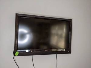 lot 132 image: 42 Vizio Wall Mount TV with Remote