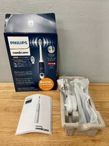 lot 89 image: Philips SonicCare 4100 Navy Blue Electric Toothbrush