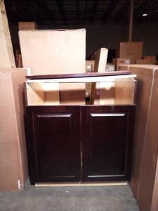 lot 43 image: Designer Series Gretna Assembled 30x34.5x23.75 in. Sink Base Kitchen Cabinet in Espresso by Hampton Bay (some damage)