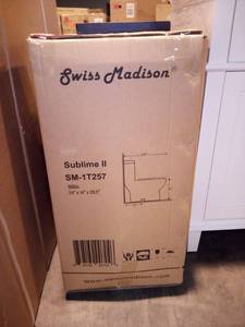lot 46 image: Sublime II 1-Piece 0.81.28 GPF Dual Flush Elongated Toilet in White by Swiss Madison