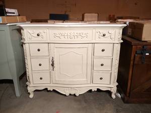 lot 86 image: Winslow 45 in. W x 22 in. D Bath Vanity in Antique White with Vanity Top in White Marble with White Basin by Home Decorators Collection (some damage)