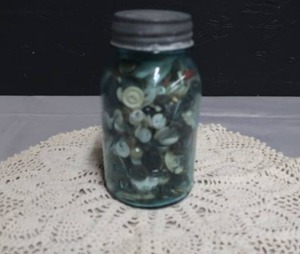 lot 58 image: VINTAGE BUTTONS IN A BLUE BALL MASON JAR