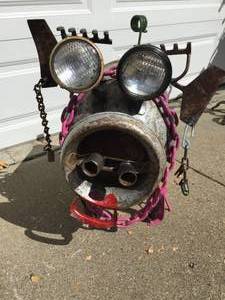 lot 310 image: Milk-can Pig With Earrings and Pink High Heels