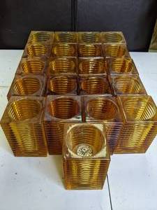 lot 80 image: Lot of 21 Amber Glass Candle Holders