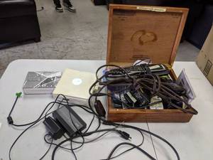 lot 752 image: Partagas Wood Cigar Box Filled with Remotes