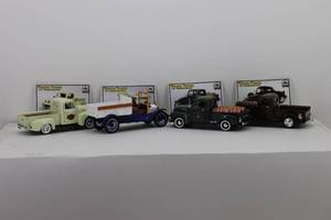 lot 47 image: (4) National Motor Museum Mint Vintage Trucks of Yesteryear 132 37 Plymouth Pickup, 50 Chevy Pickup, 49 Ford Pickup, 20 White Pickup