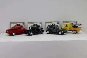 lot 48 image: (4) National Motor Museum Mint Vintage Trucks of Yesteryear 132 38 Dodge Pickup, 25 Ford TT, 37 Studebaker Pickup, 48 Dodge Pickup