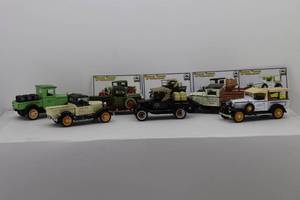 lot 53 image: (6) National Motor Museum Mint Vintage Trucks of Yesteryear 132 28 Chevy 12 ton, 28 Ford Model 76A, 34 Ford Stake Fence Truck, 32 Chevy