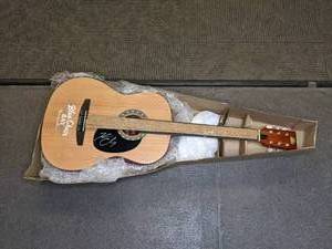 lot 2 image: Kenny Chesney Autographed Acoustic Guitar w COA