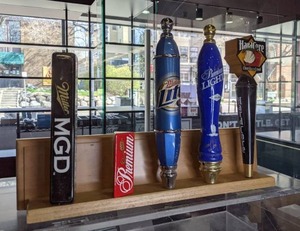 lot 77 image: Five Beer Tap Handles MGD, Miller Light, Grain Belt, Hard Core Cider