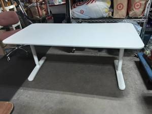 lot 25 image: Ikea Bekant Adj Height Work Table 63x32