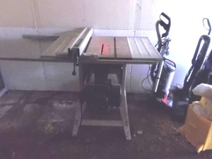 lot 63 image: 10 Delta Table Saw With Bar & Stand-Works Well
