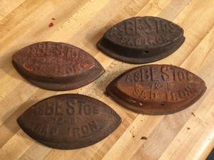 lot 130 image: 4 Cast Asbestos Sad Irons