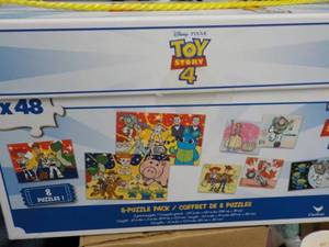 lot 55 image: Toy Story 8 Puzzle Pack...