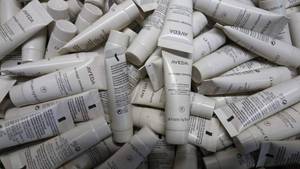 lot 9 image: Tub Full of Aveda Hair Repair .34 Fl. Oz. Bottles