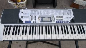 lot 14 image: Casio Keyboard with Stand Model # CTK- 496