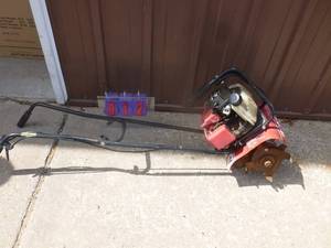 Honda mini tiller. Has been sitting for a while. Needs primer & tlc. As shown.