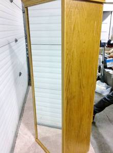 COLONIAL STYLING 2 DOOR 4 DRAWER TALL DRESSER CABINET ARMOIRE WITH FULL LENGTH MIRROR ON THE BACK SIDE&nbsp - THIS DELIGHTFUL PIECE USED TO HAVE A ROTATING BASE HOWEVER IT IS NO LONGER THERE....STILL A GREAT ARMOIRE WITH VERY LITTLE WEAR &amp TEAR