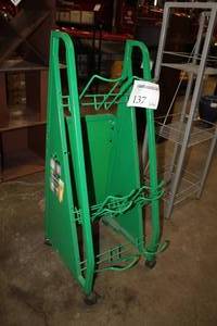 lot 137 image: Heineken Metal Mini Keg Display Rack 5-Liter Green 22Wx17Dx45H