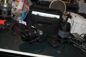 lot 41 image: Canon EOS Rebel T3i Digital SLR  with Canon EF 75-300mm Zoom Lens, Camera Bag, Lens on Camera Body