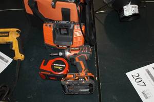 lot 79 image: Ridgid 18V Cordless Impact Wrench R86034  with Battery, Charger, Case