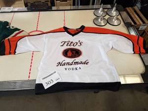 lot 303 image: Kobe Sportswear Titos Handmade Vodka Hockey Jersey Large WhiteOrange