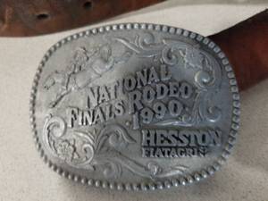 lot 329 image: Leather Belt  with Hesston 1990 National Finals Rodeo Commemorative Series Limited Collectors Buckle by Awards Design Medals