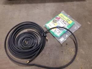 lot 346 image: Dumpster In A Bag 2 cu.yd. (in package), Garden Hose, SprinklerSoaker Hose 50
